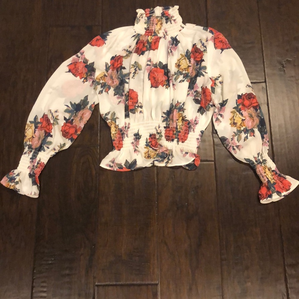 White blouse with turtle neck and floral prints